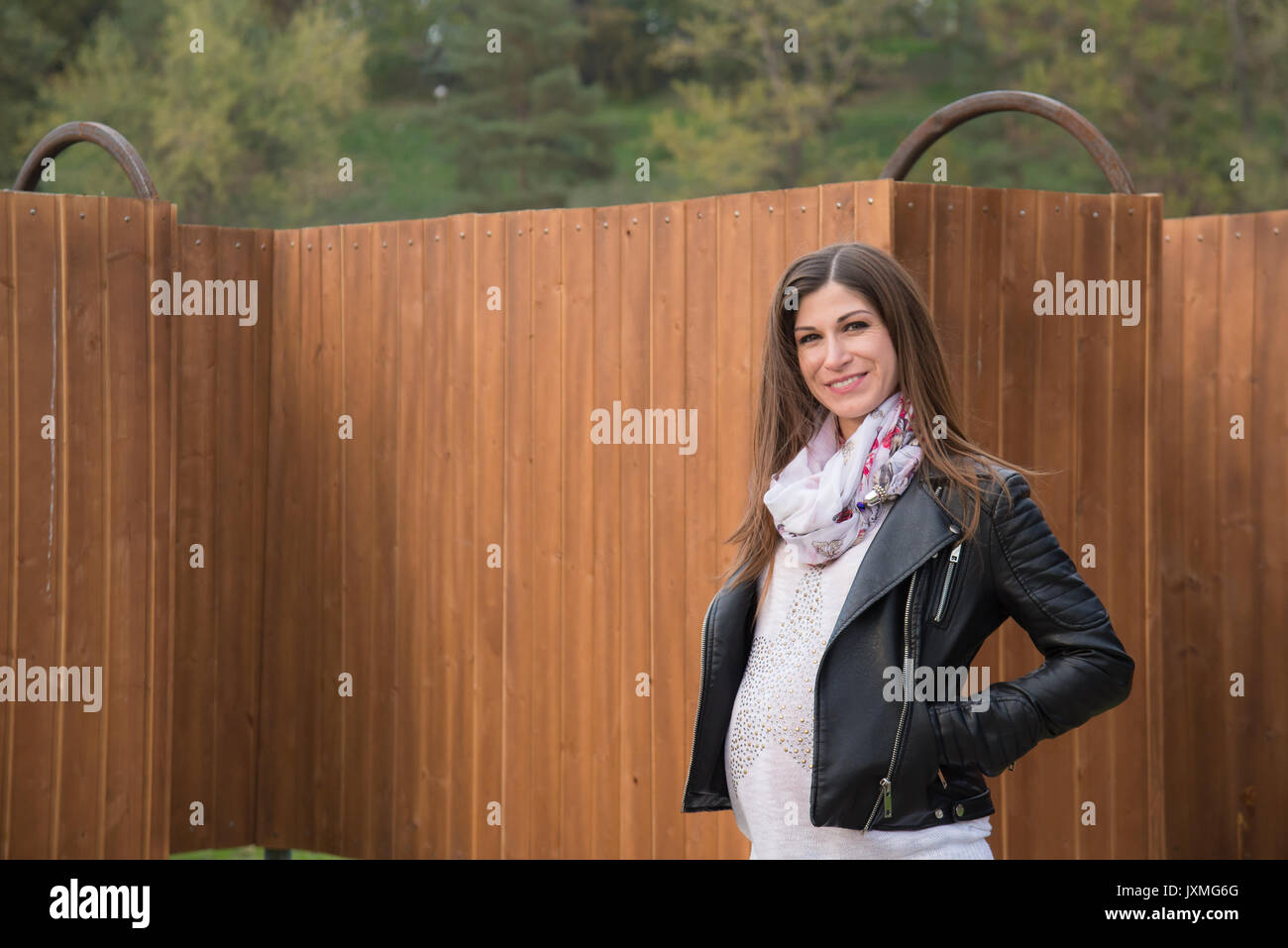 The pregnant girl on walk in city park Stock Photo - Alamy