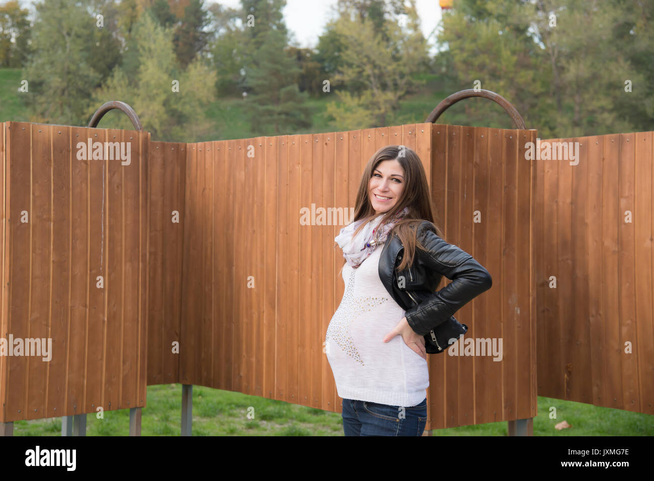 The pregnant girl on walk in city park Stock Photo - Alamy