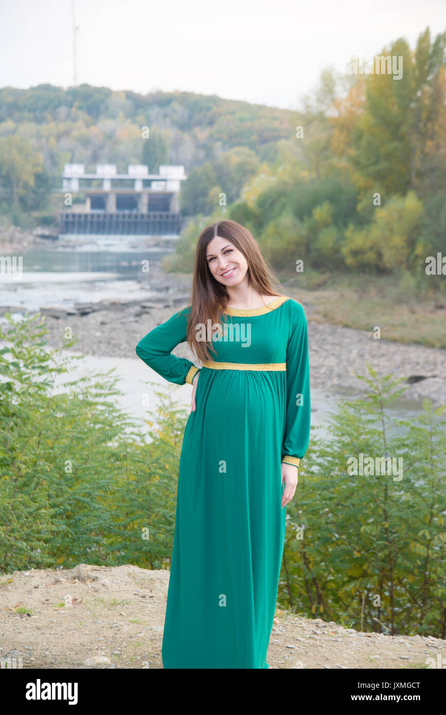 The pregnant girl on walk in city park Stock Photo - Alamy