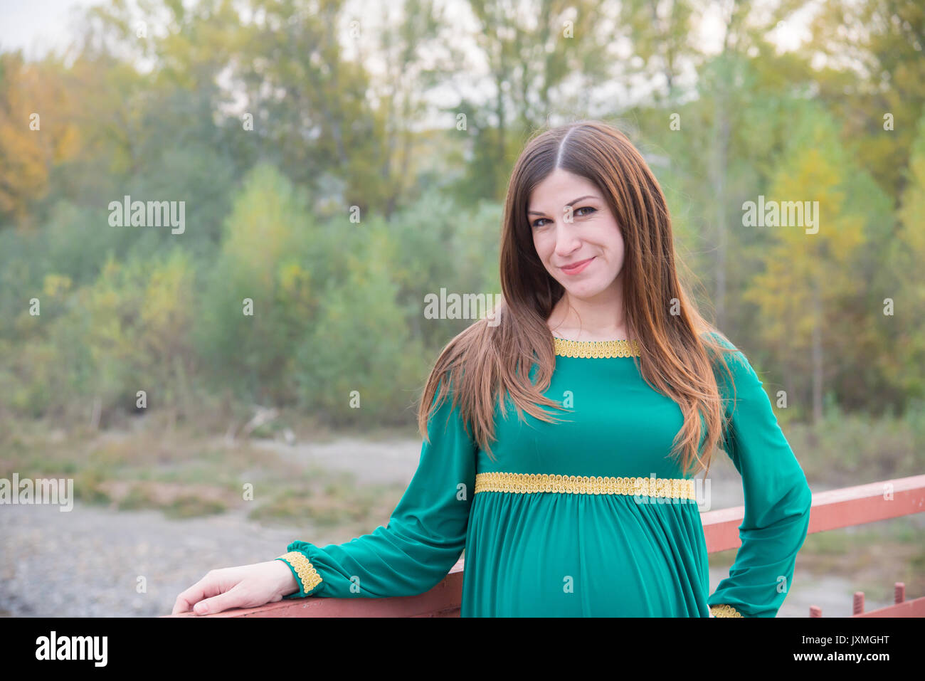 The pregnant girl on walk in city park Stock Photo - Alamy
