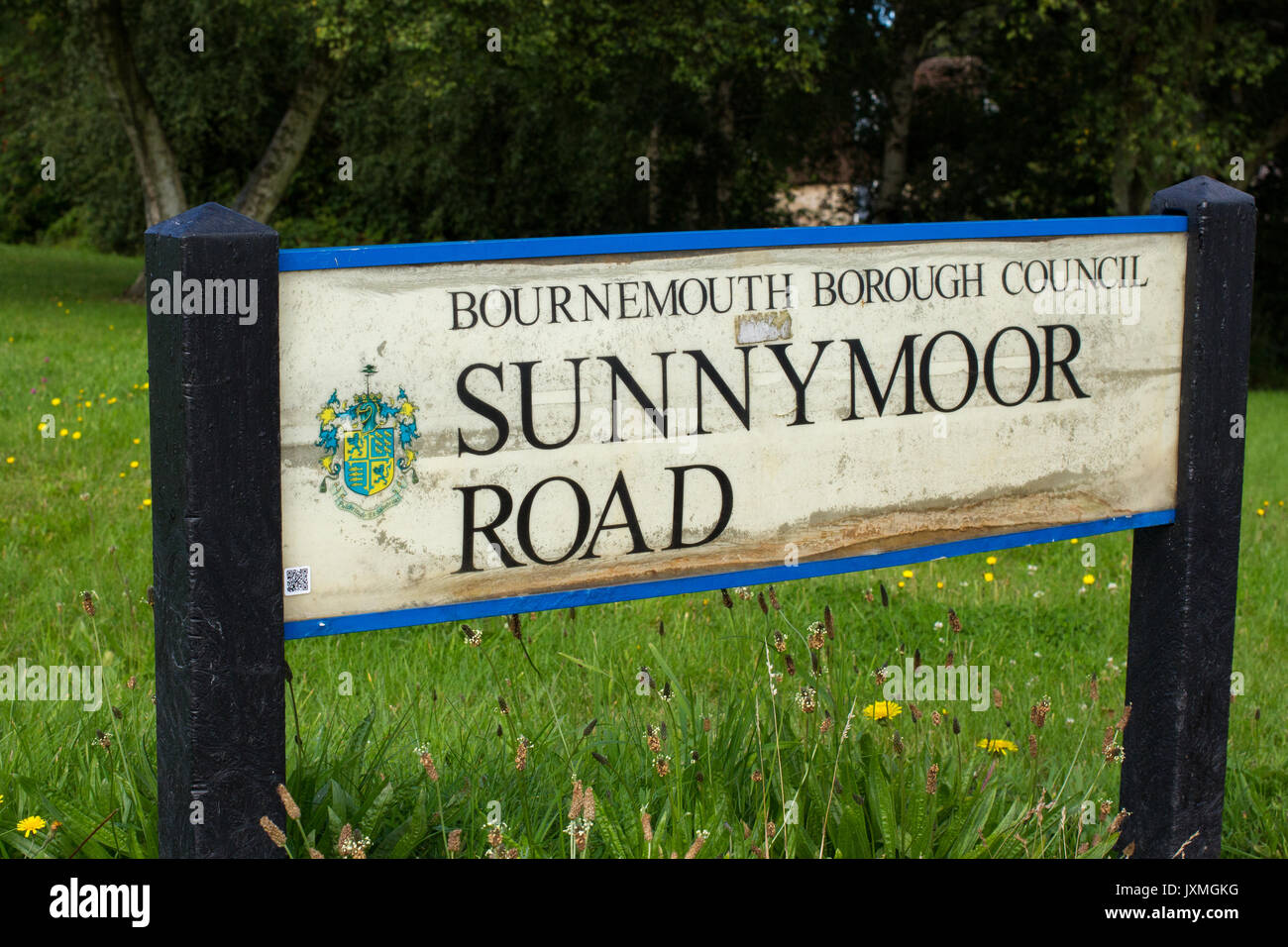 Road name sign Sunnymoor Road in Wallisdown, Bournemouth, UK Stock Photo