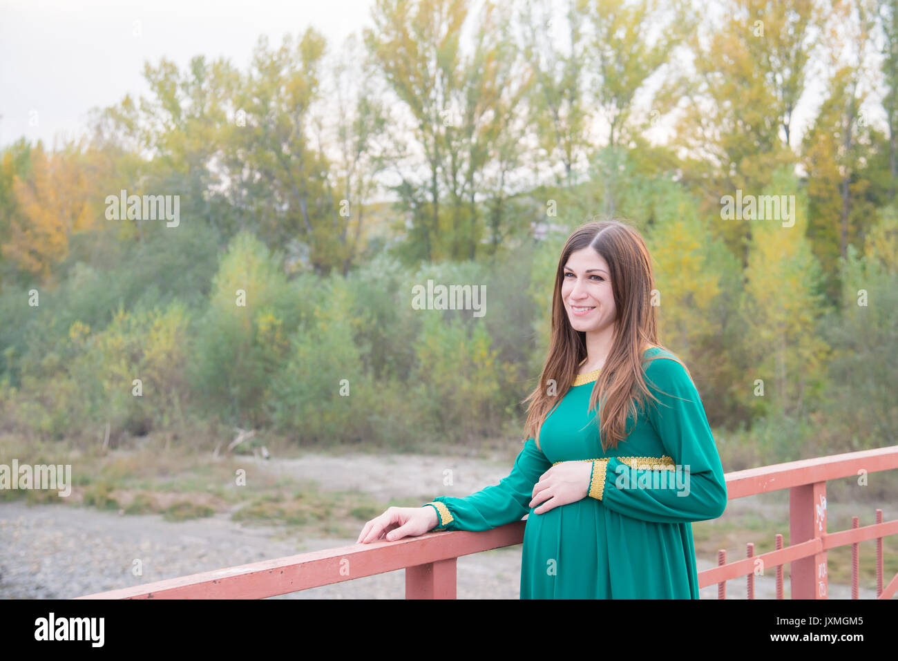 The pregnant girl on walk in city park Stock Photo - Alamy