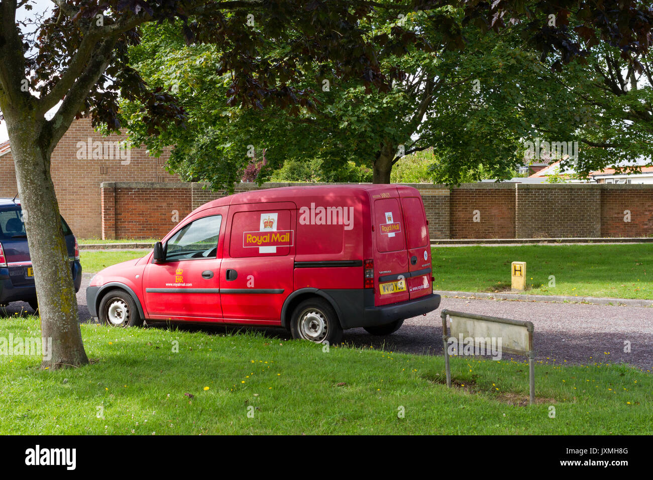 Royal Mail postal delivery van parked in a residential area Stock Photo