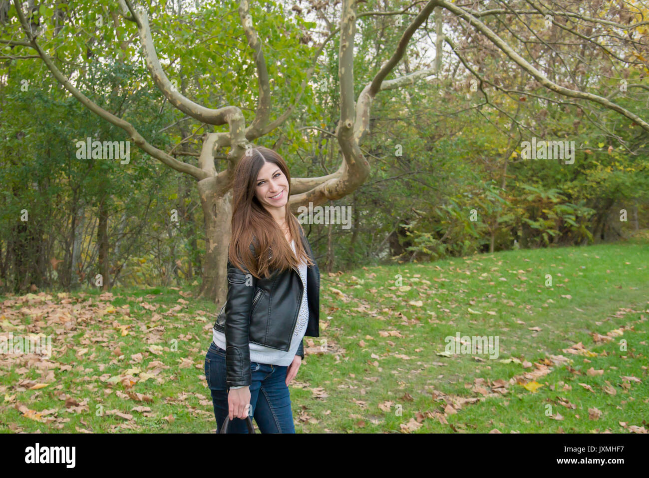 The pregnant girl on walk in city park Stock Photo - Alamy