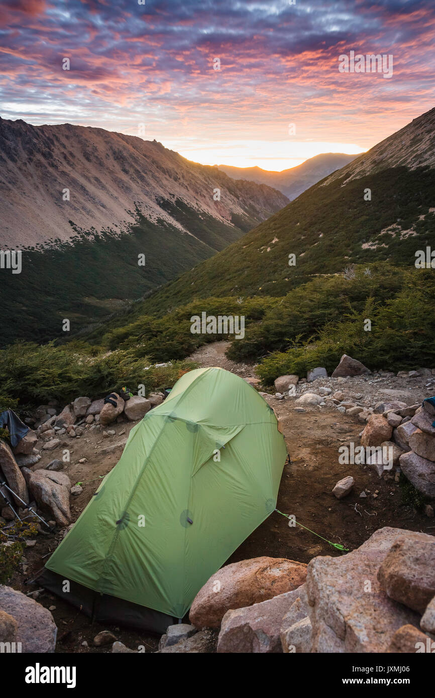 Tent at mountain landscape at sunrise, Nahuel Huapi National Park, Rio Negro, Argentina Stock Photo