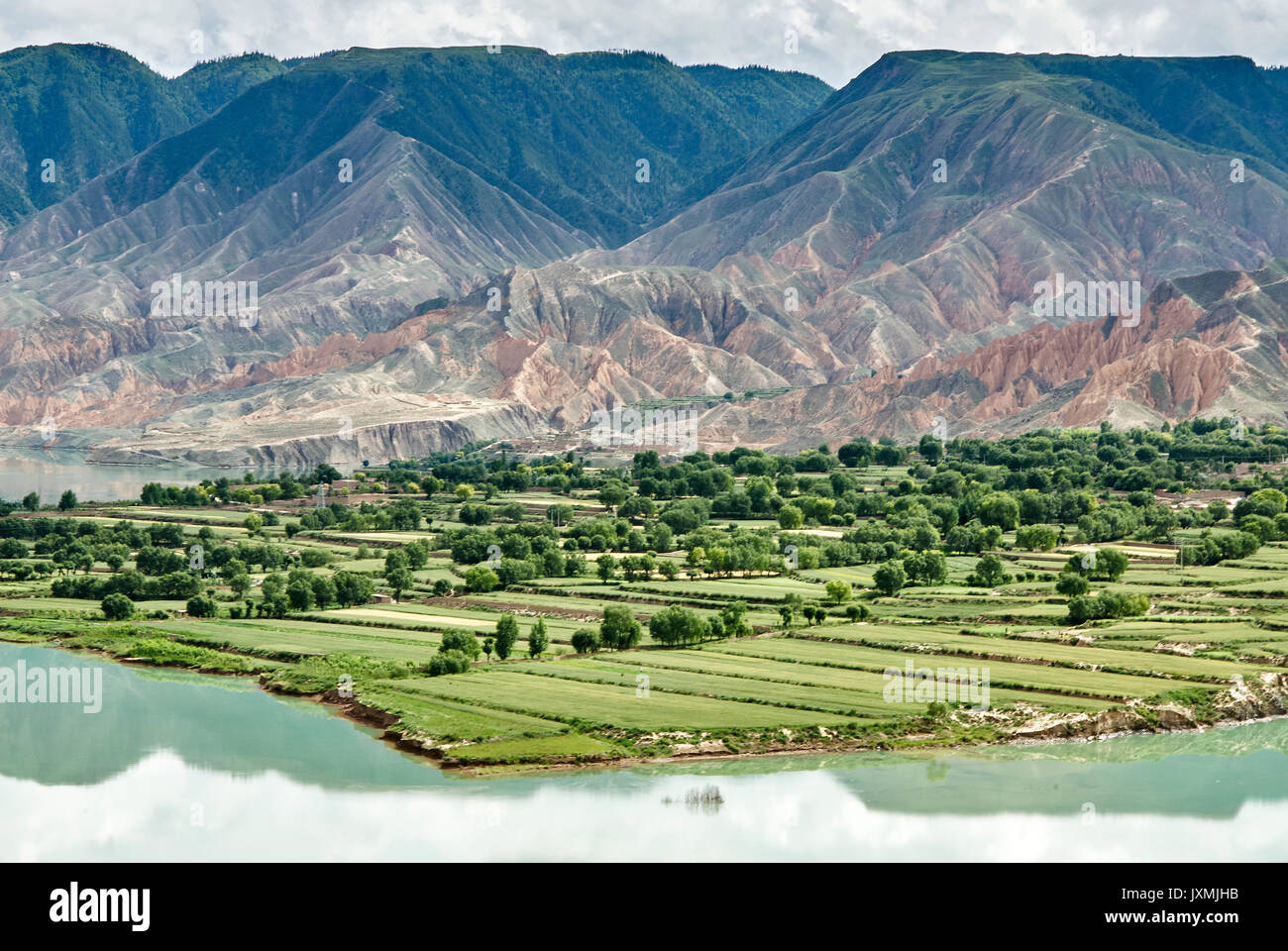 Elevated view of mountains and agricultural land by Yellow river, Sichuan, China Stock Photo