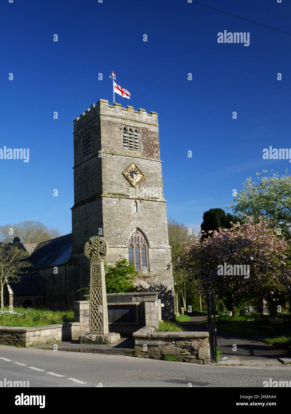 The church of St Andrew's, Tywardreath, Cornwall.  The tower dates from the 14th century and the rest of the building from the 1880's.  It is flying t Stock Photo