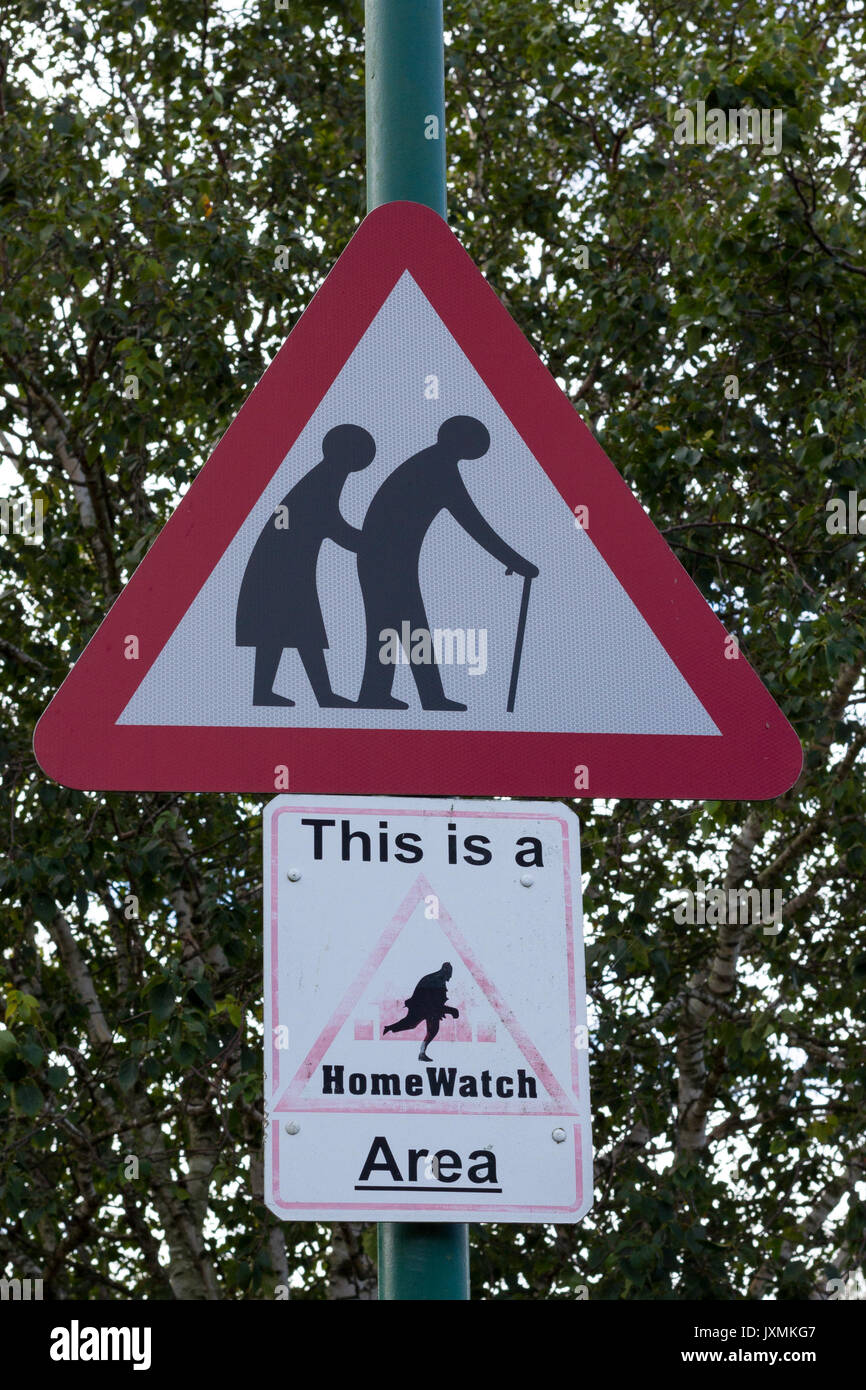 Old people warning red triangular road sign, This is a HomeWatch Area sign, Dorset, UK Stock Photo