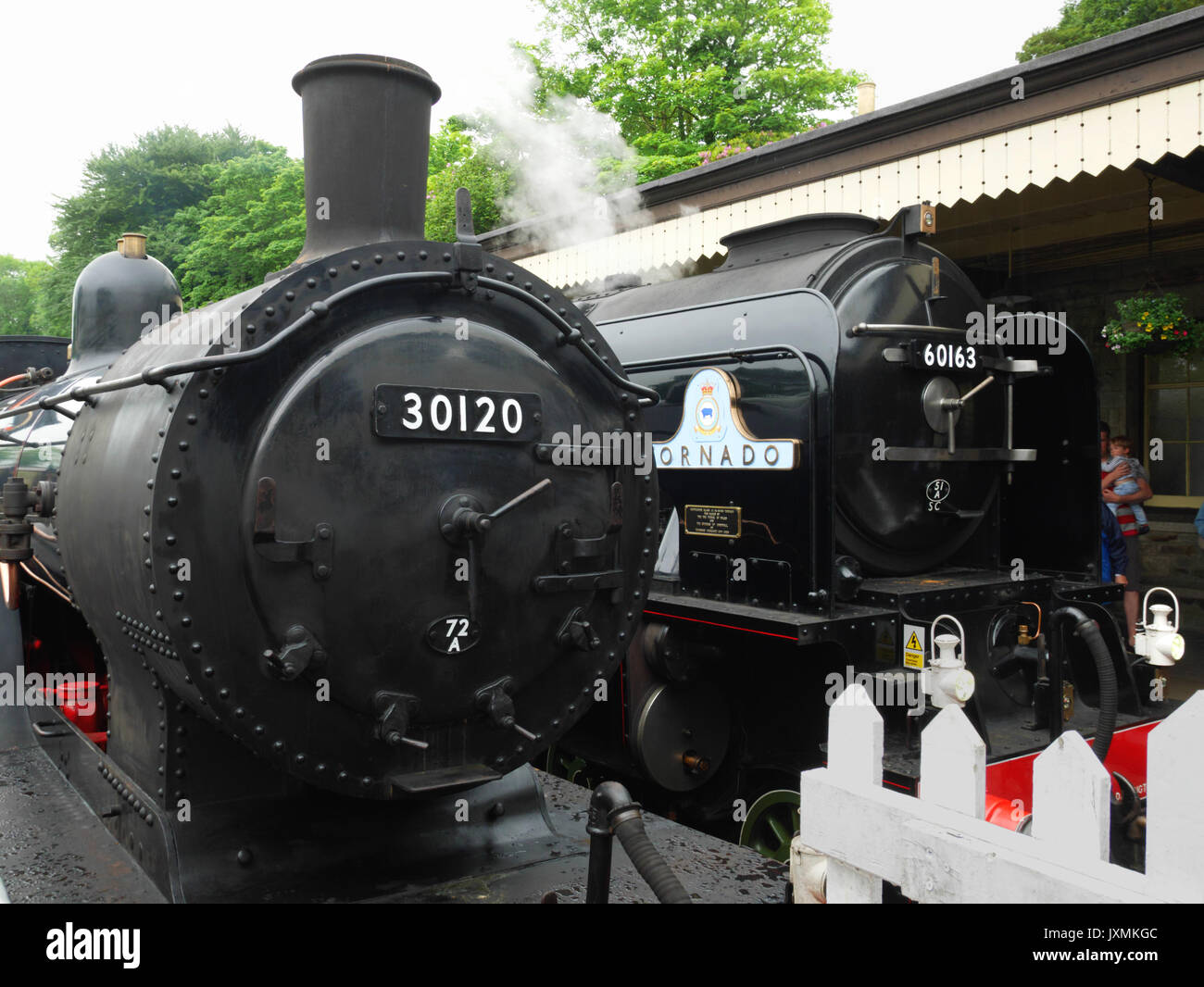 109 years separate these two locomotives at Bodmin General (Bodmin and Wenford Railway) on 2nd June 2017.  T9 30120 (left) was built in 1899 and Torna Stock Photo