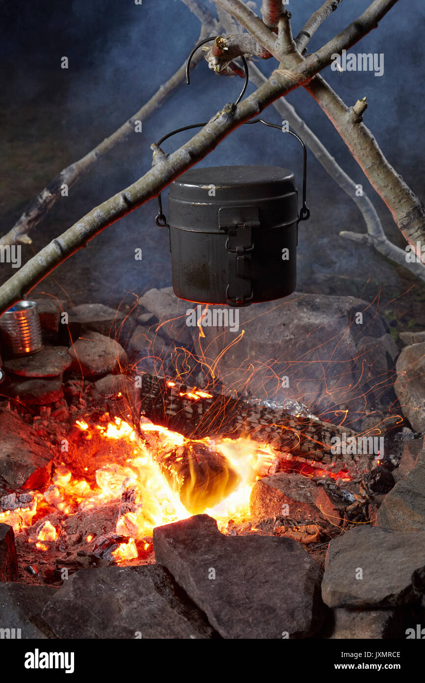 Pot of food cooking over camp fire, close-up, Colgate Lake Wild Forest, Catskill Park, New York State, USA Stock Photo
