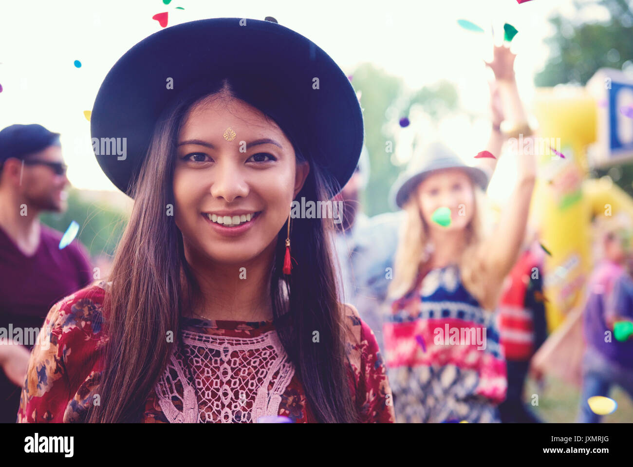 Portrait of young woman in trilby at festival Stock Photo