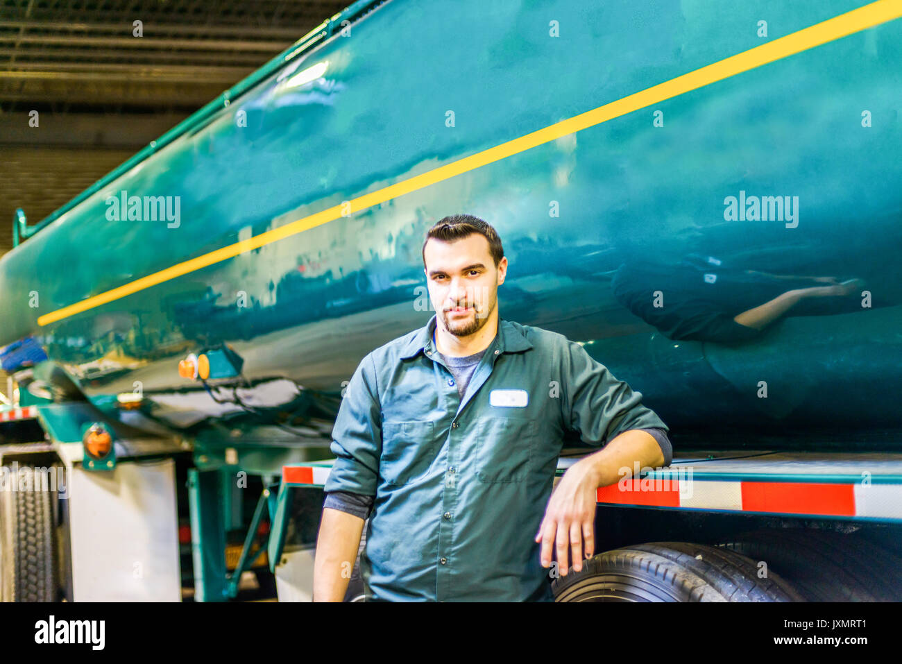 Portrait of young male trucker at biofuel industrial plant Stock Photo