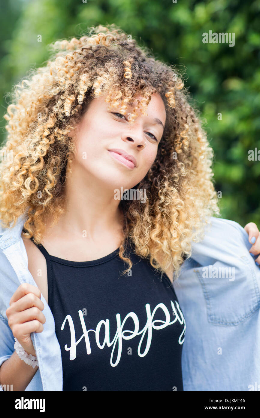 Woman opening shirt to reveal emotions Stock Photo