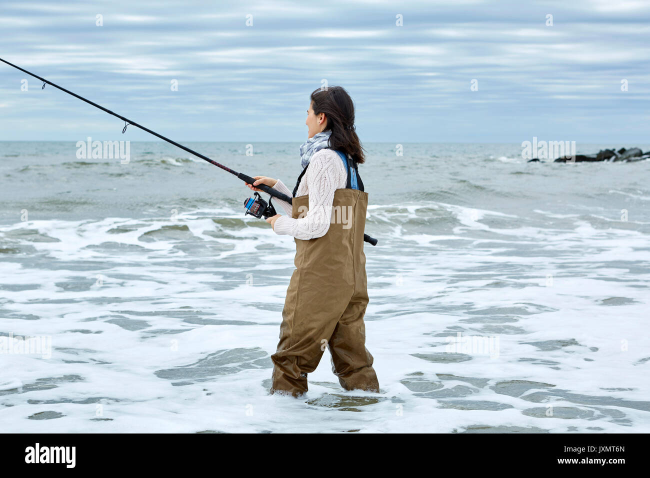 Tourist fisherman's set. Fishing rod and backpack. Fishing composition with  spinning and knife Stock Photo - Alamy