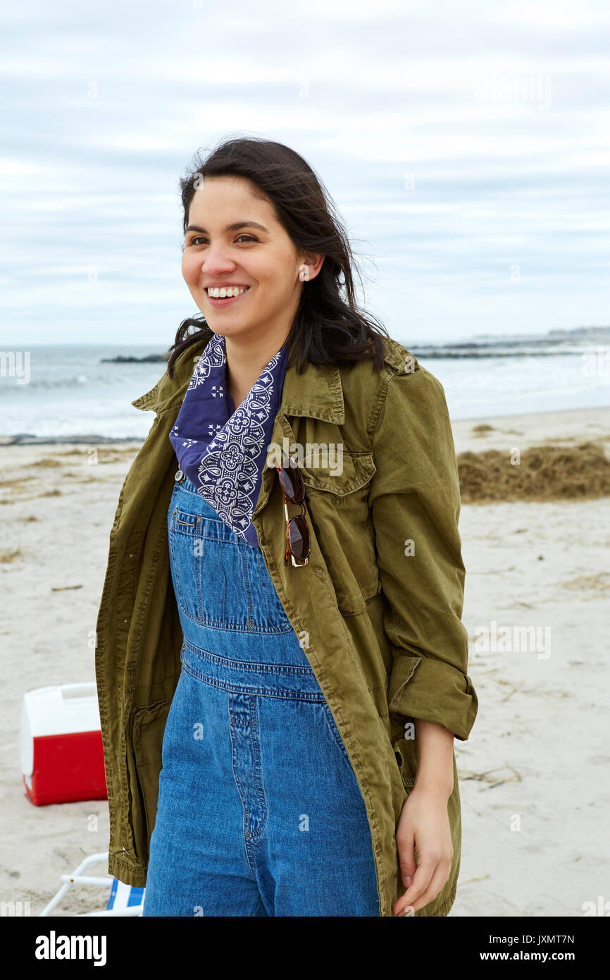 Portrait of smiling young woman on beach Stock Photo - Alamy