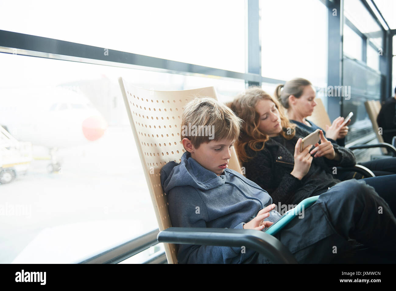 Family at airport on way to holiday, Copenhagen, Denmark Stock Photo