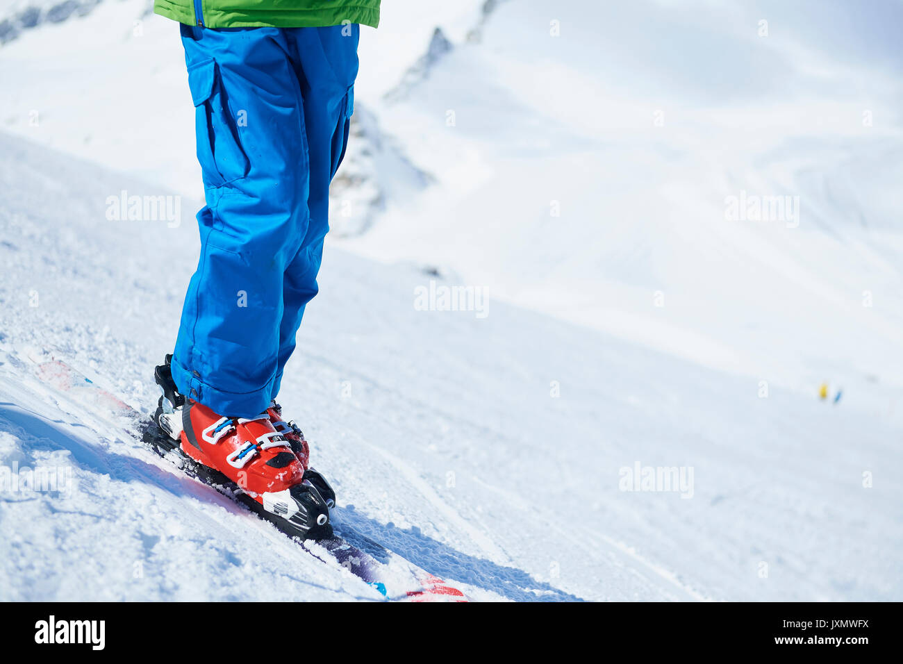 Close up of skier's legs on snow Stock Photo