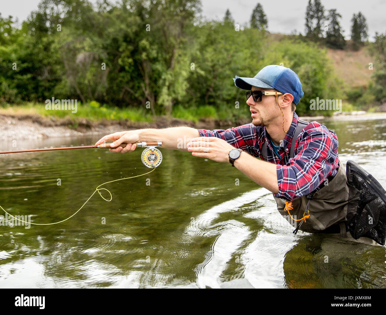 Man fishing in river, Clark Fork, Montana and Idaho, US Stock Photo