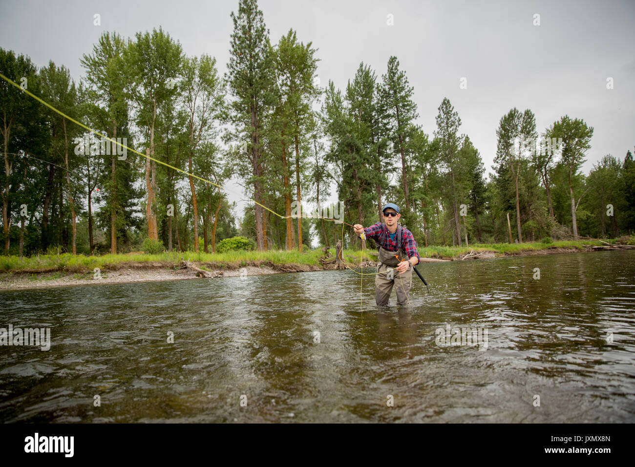 Man fishing in river, Clark Fork, Montana and Idaho, US Stock Photo