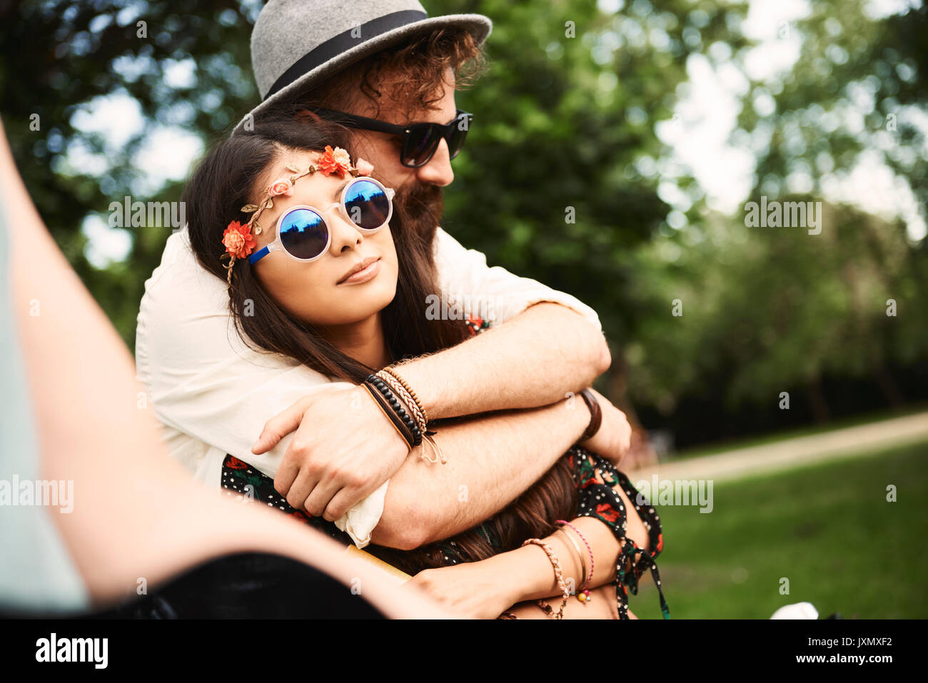 Romantic young boho couple hugging at festival Stock Photo