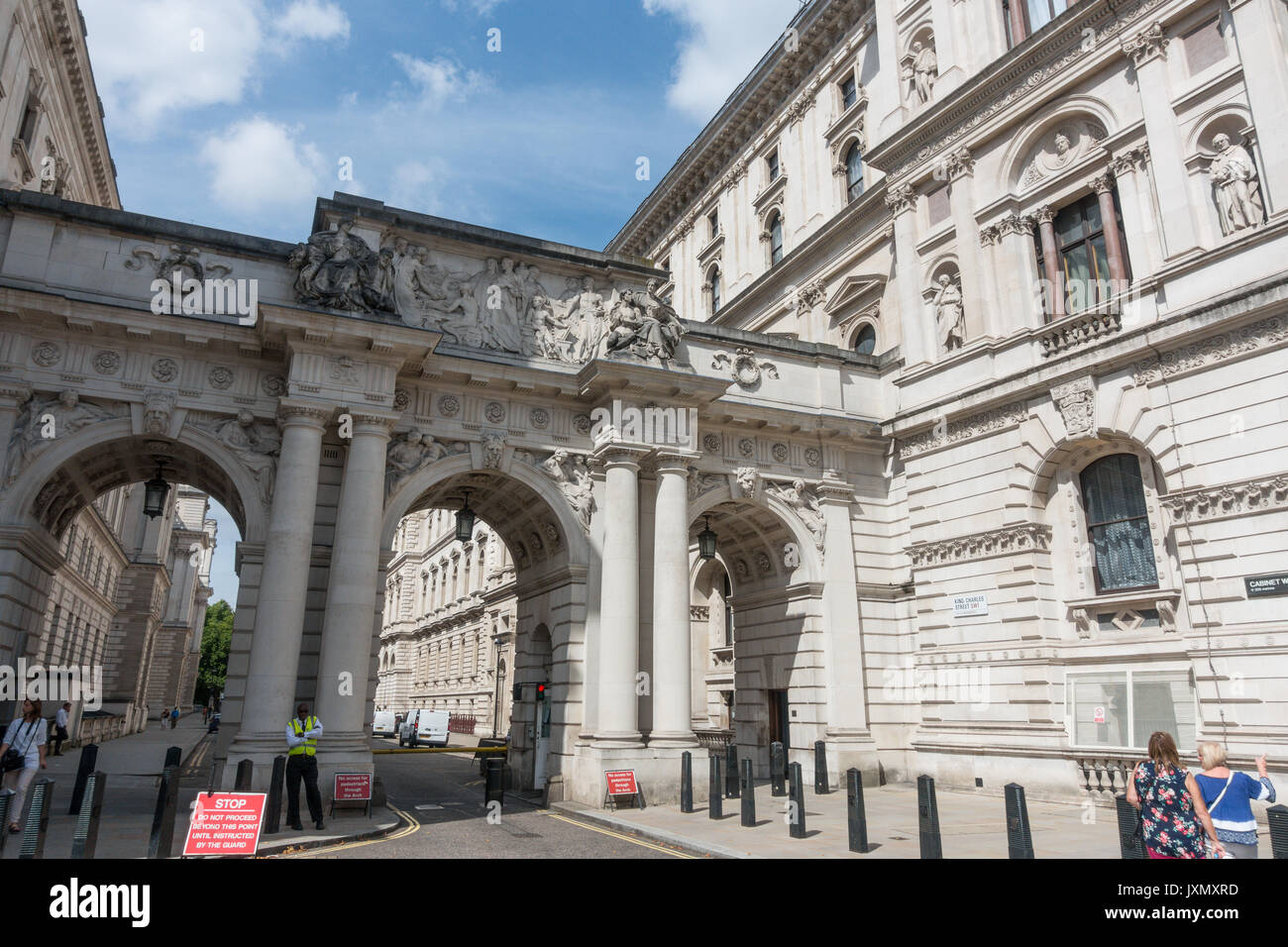 Security man standing near the entrance to Downing street, Whitehall, Westminster, London, SW1A 2AS, UK Stock Photo