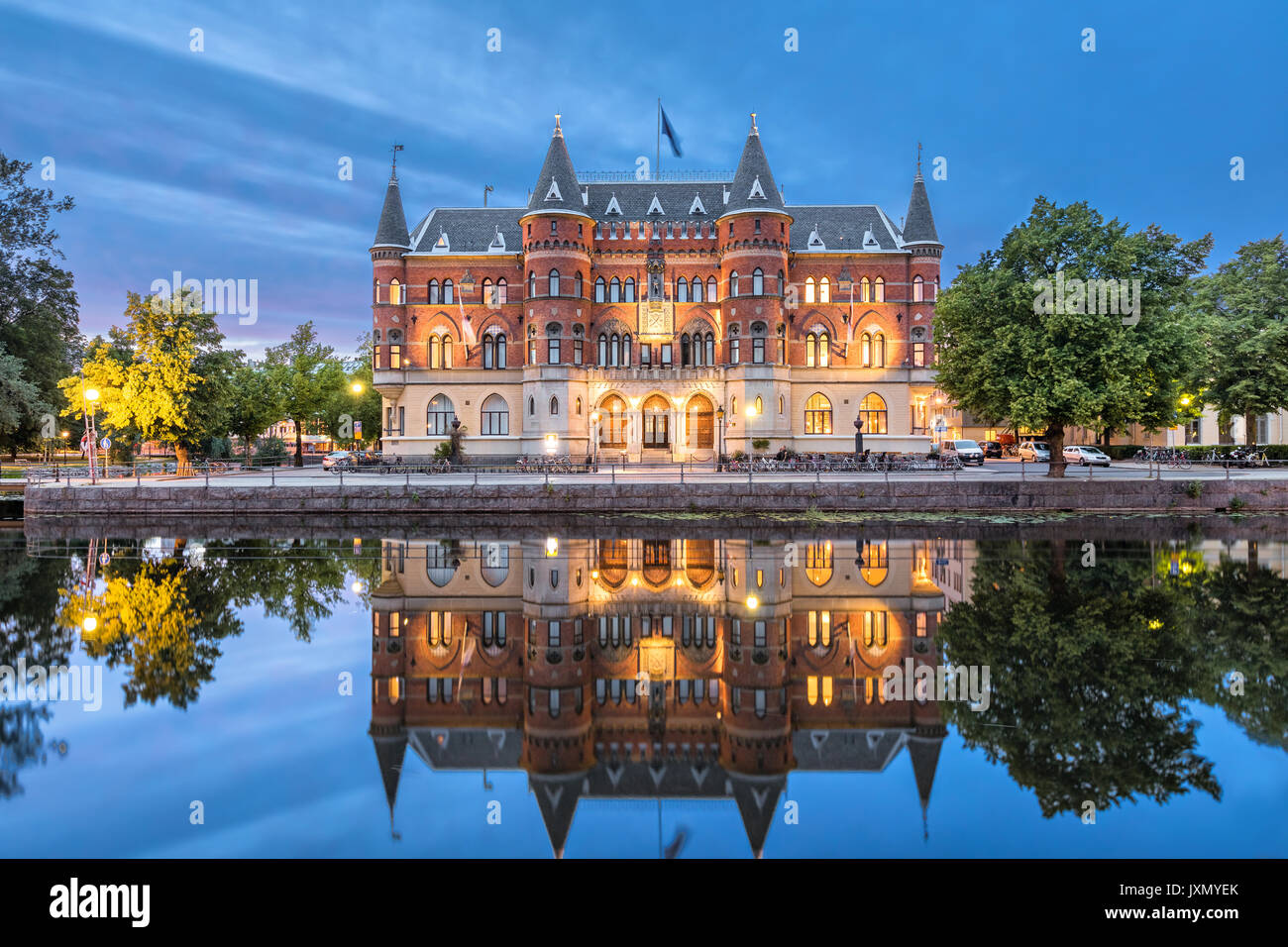 Orebro city in Sweden. Beautiful old building from 19th century in the evening, architectural landmark located on the embankment of Svartan river. Stock Photo