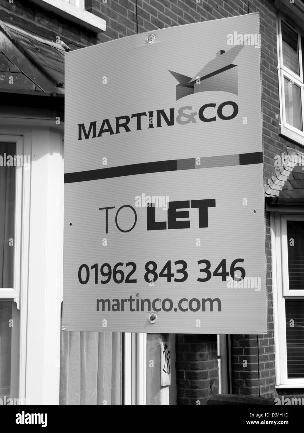 Martin and Co Estate agent sign advertising residential house to let