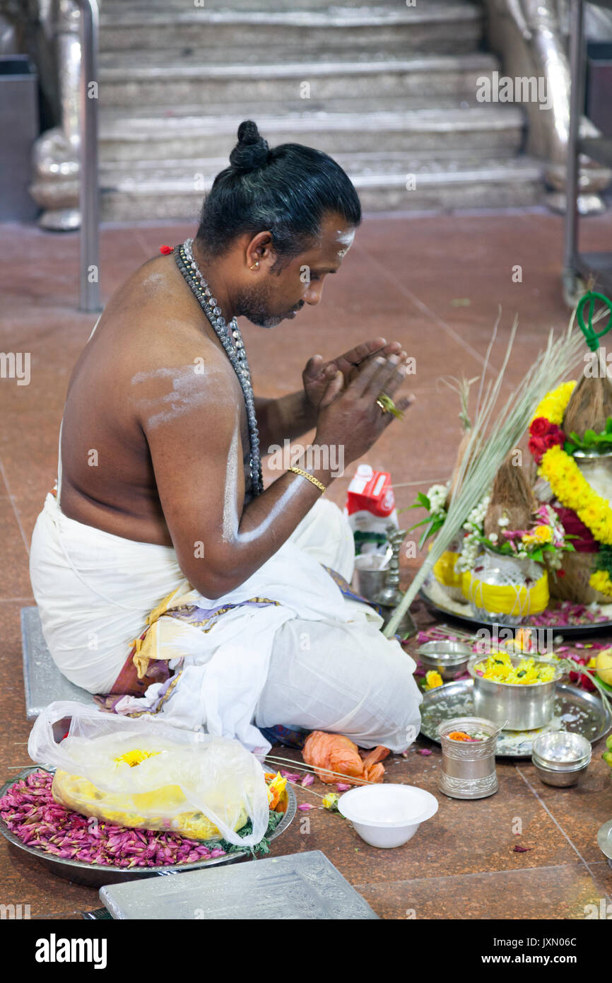Singapore - February 21, 2016 : hindu priest parying in Sri Veeramakaliamman  temple, Little India district Stock Photo