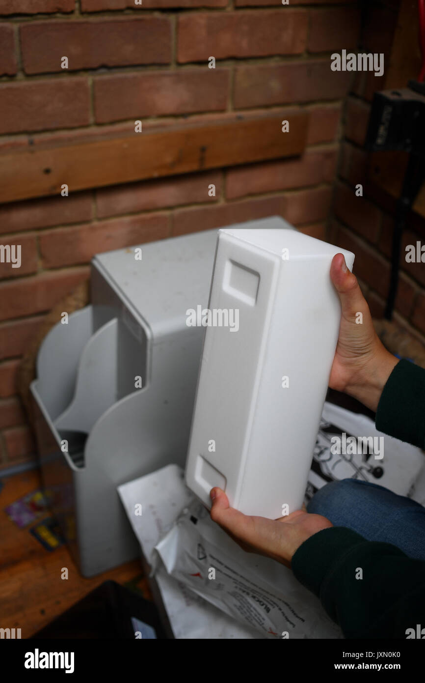 re filling a water softener with block salt Stock Photo