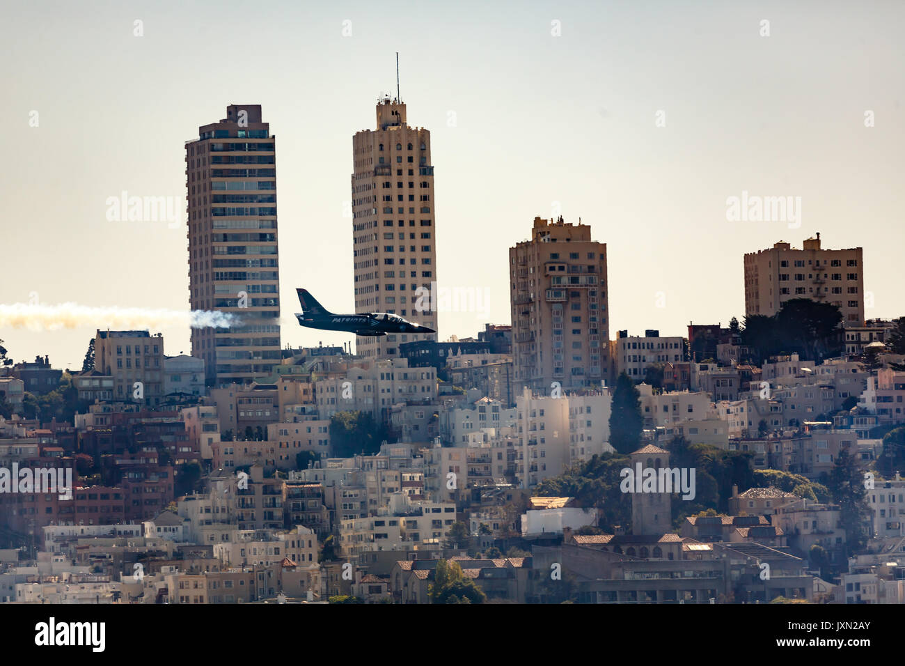 Patriot jet flys low in front of San Francisco skyline during fleetweek airshow Stock Photo