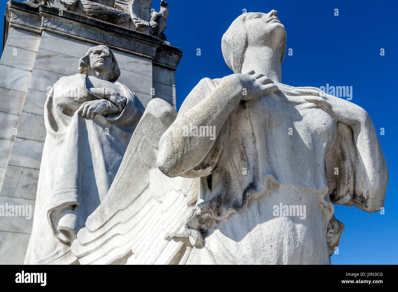 Statues depicting Christopher Columbus and Native American greet