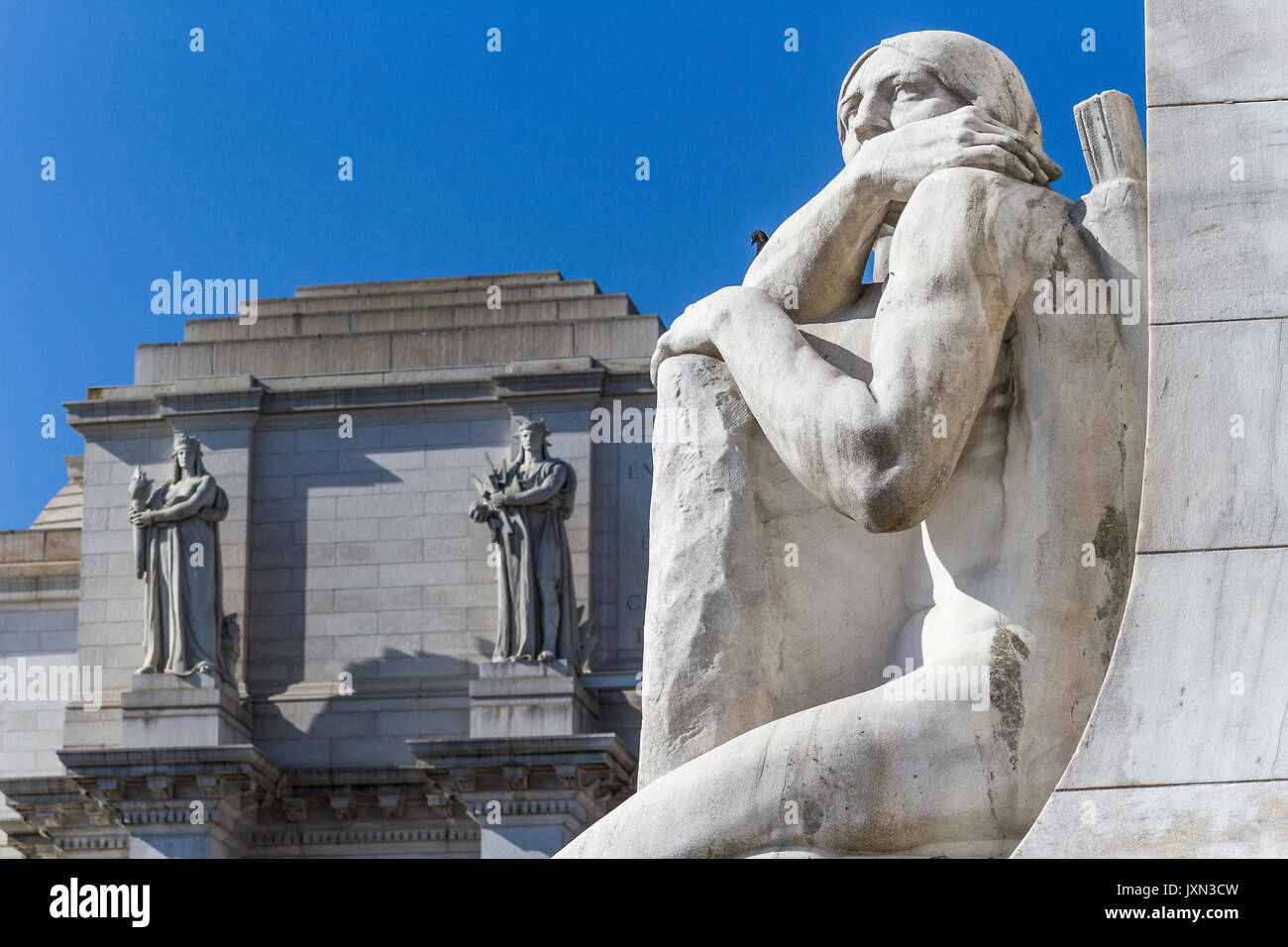 Statues depicting Christopher Columbus and Native American greet