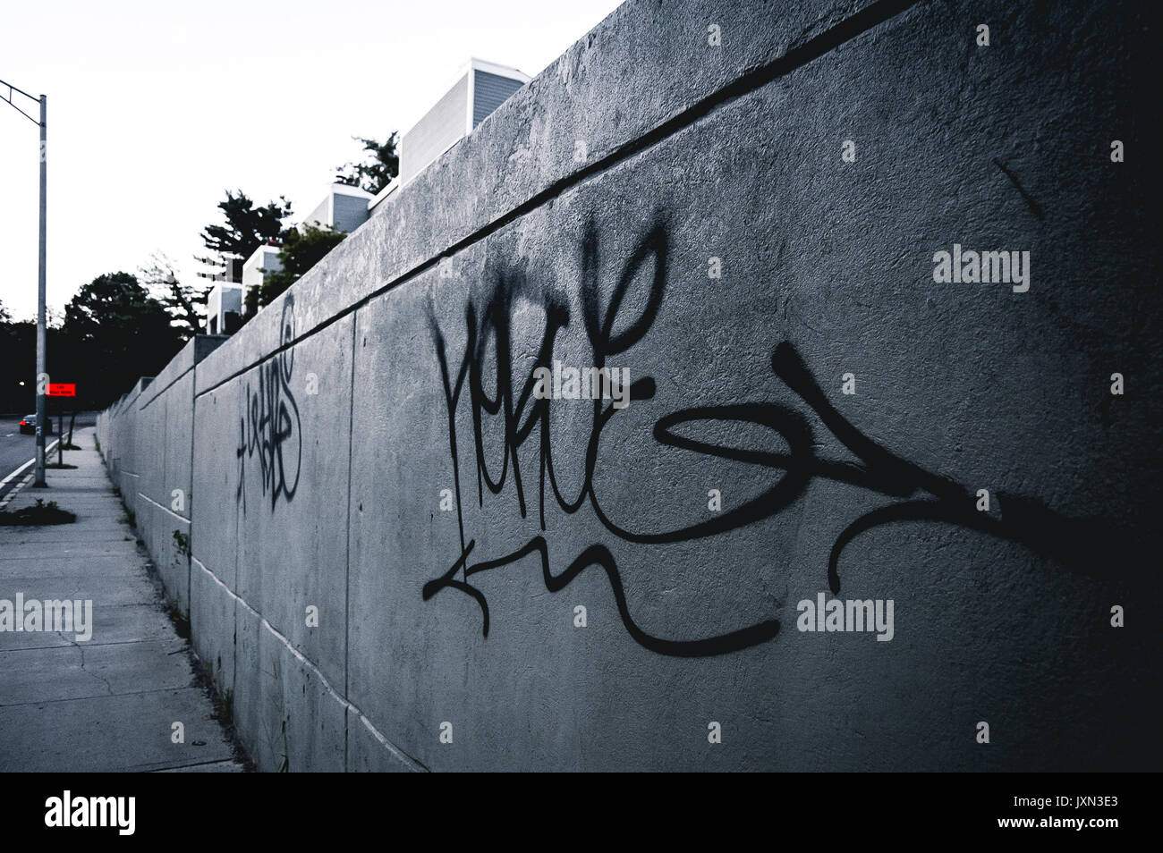 Minimalist urban graffiti on a gray day. Stock Photo