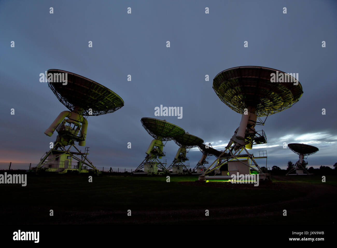 The Arcminute Microkelvin Imager AMI at the Mullard radio observatory, Barton Cambridgeshire, at night, light-painted with daylight balanced lamps. Stock Photo