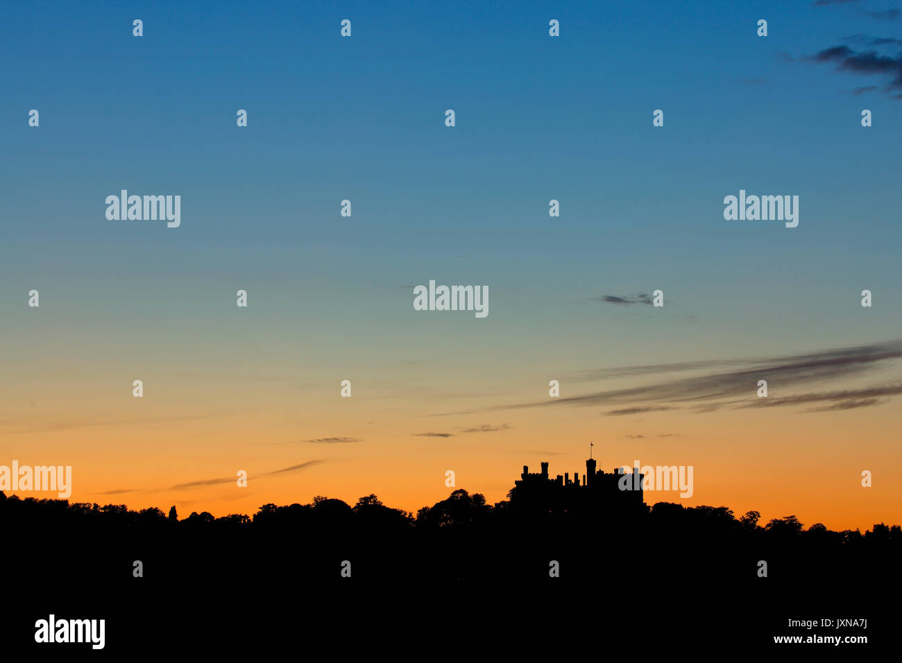 Belvoir Castle near Grantham Leicestershire silhouetted against a post sunset sky Stock Photo