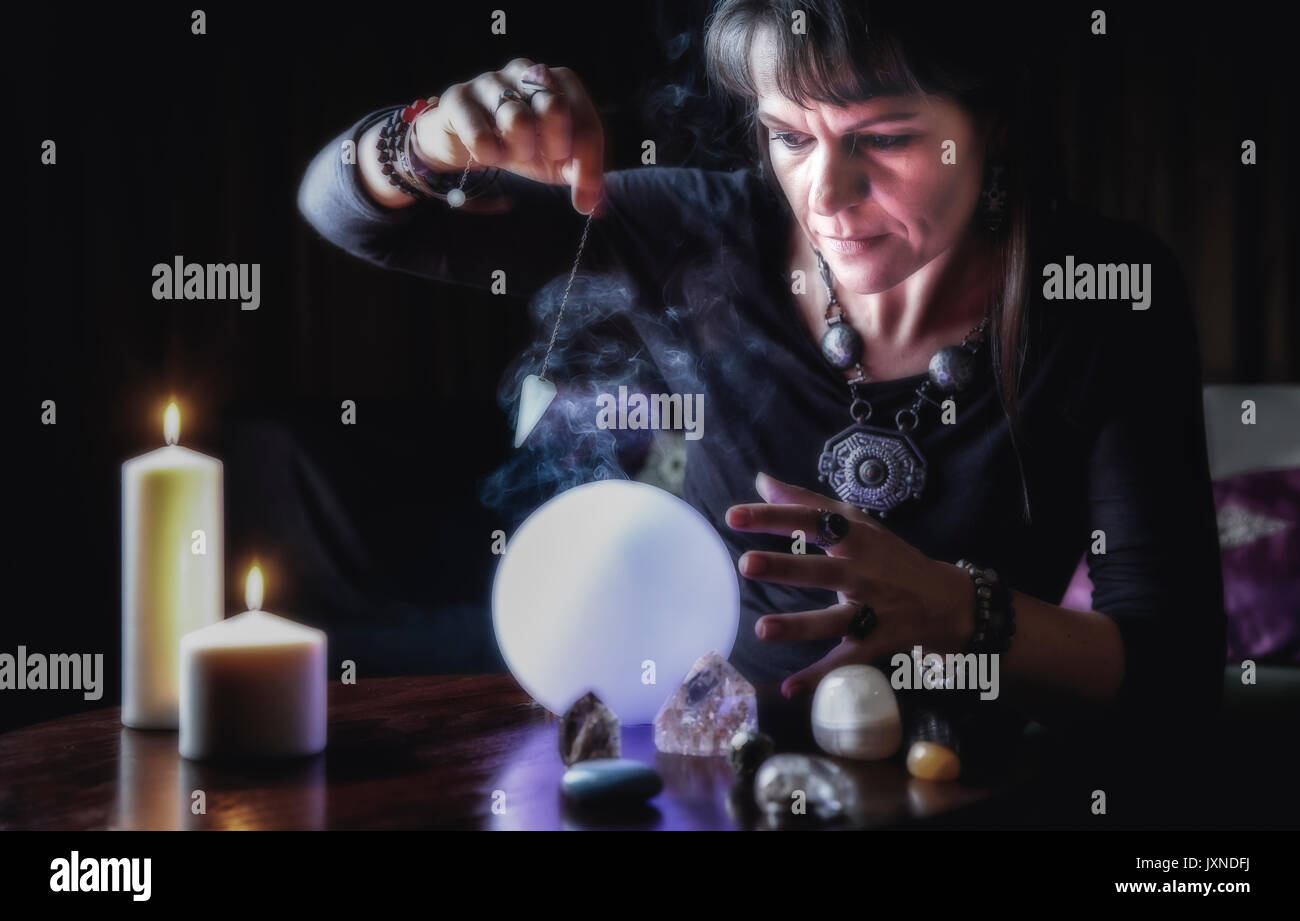 middle aged woman reading a fortune Stock Photo