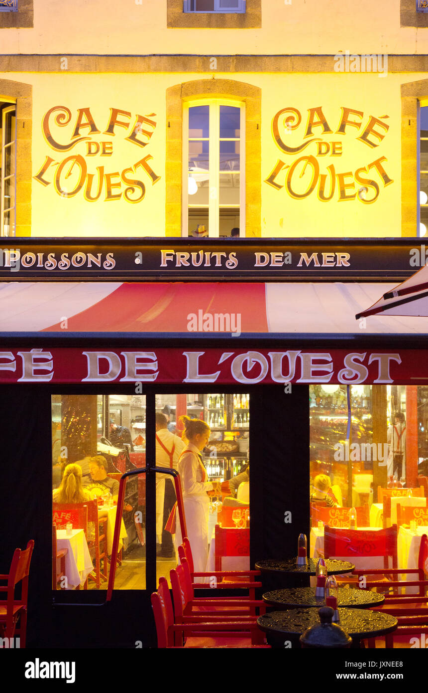 France cafe -  the Cafe de L'Ouest, exterior, at night, Old town, St Malo Brittany France Europe Stock Photo