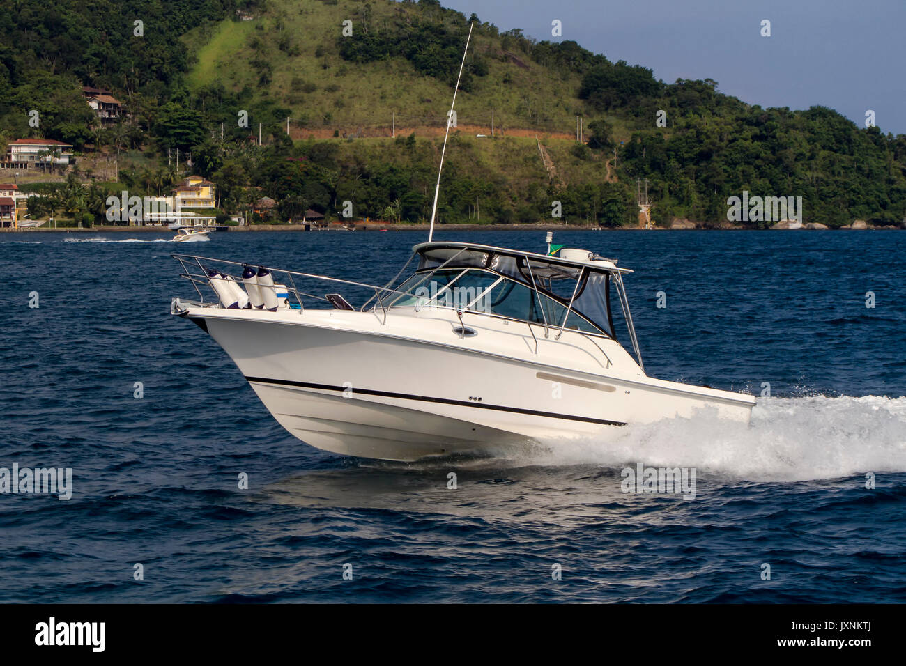 Motor Boat in Angra dos Reis bay area during the summer time Stock Photo