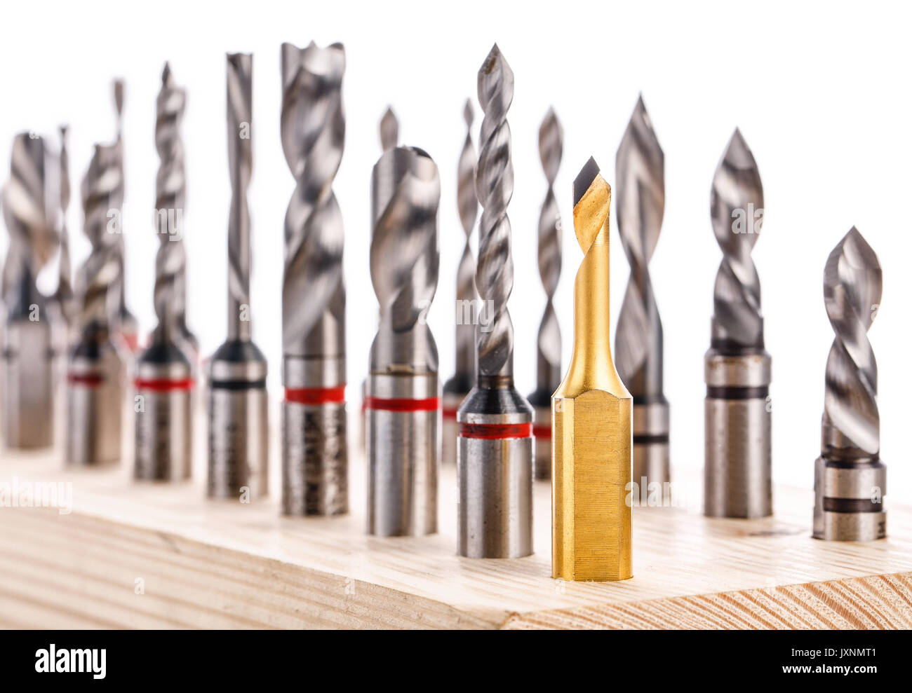 set of different drill bits for wood standing on wooden stand Stock Photo