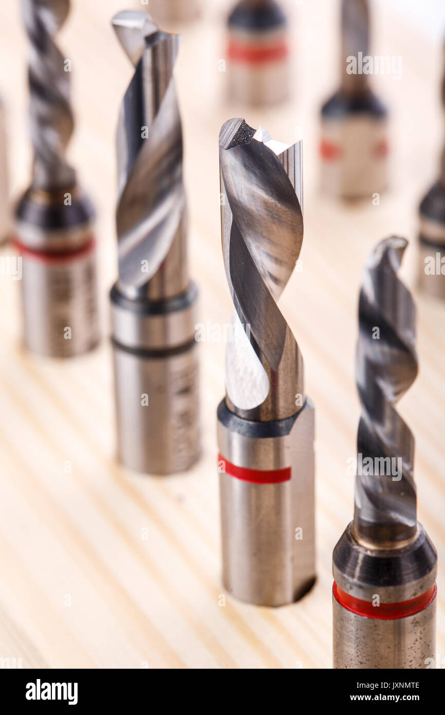 various shapes drill bits for wood on wooden stand. close-up macro photo Stock Photo