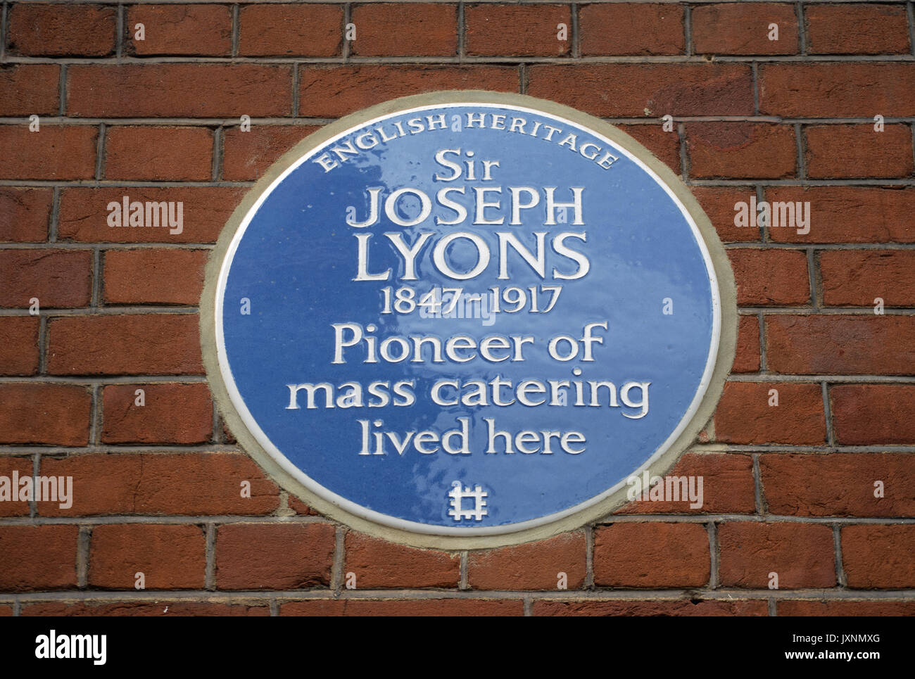 english heritage blue plaque marking a home of mass catering pioneer  sir joseph lyons, in west kensington, london, england Stock Photo