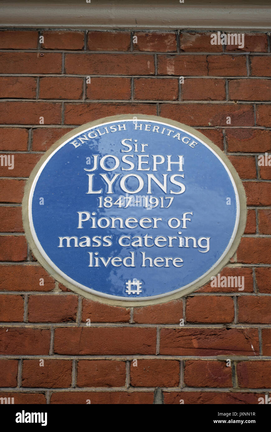 english heritage blue plaque marking a home of mass catering pioneer  sir joseph lyons, in west kensington, london, england Stock Photo