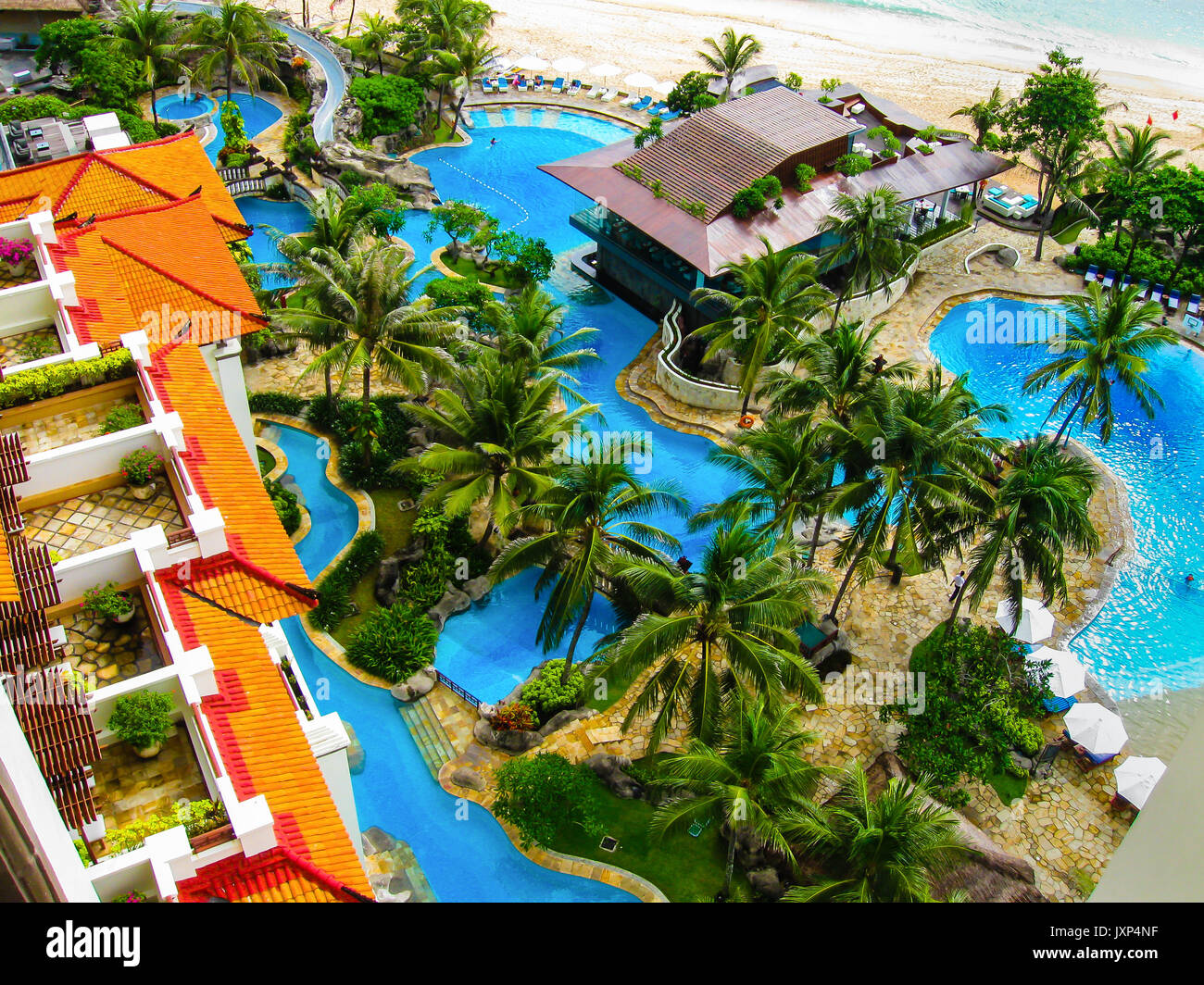 Bali, Indonesia - December 30, 2008: The pools and beach of ocean in Nusa Dua Grand Nikko hotel Stock Photo