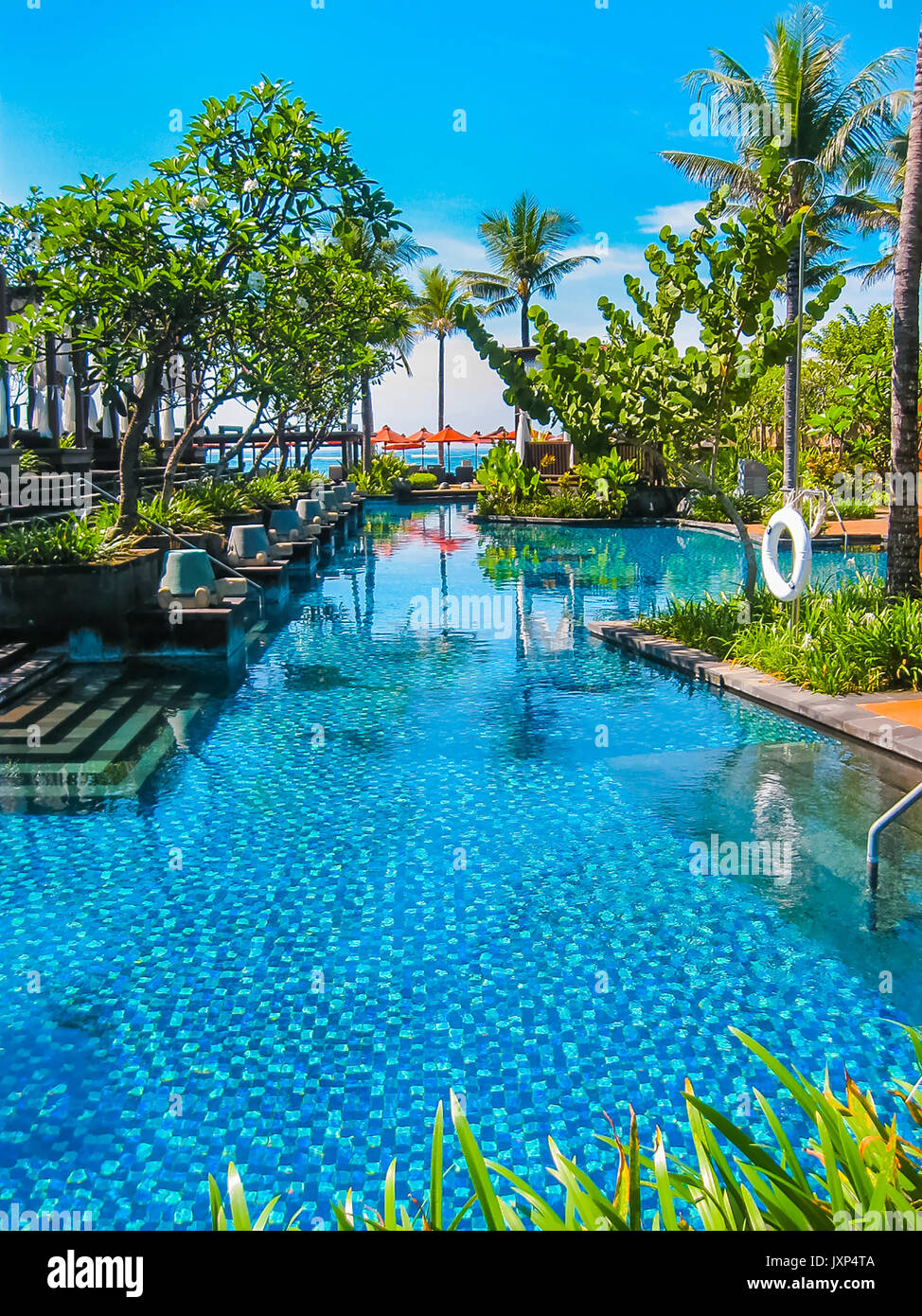 Bali, Indonesia - April 14, 2012: View of swimming pool at St. Regis ...