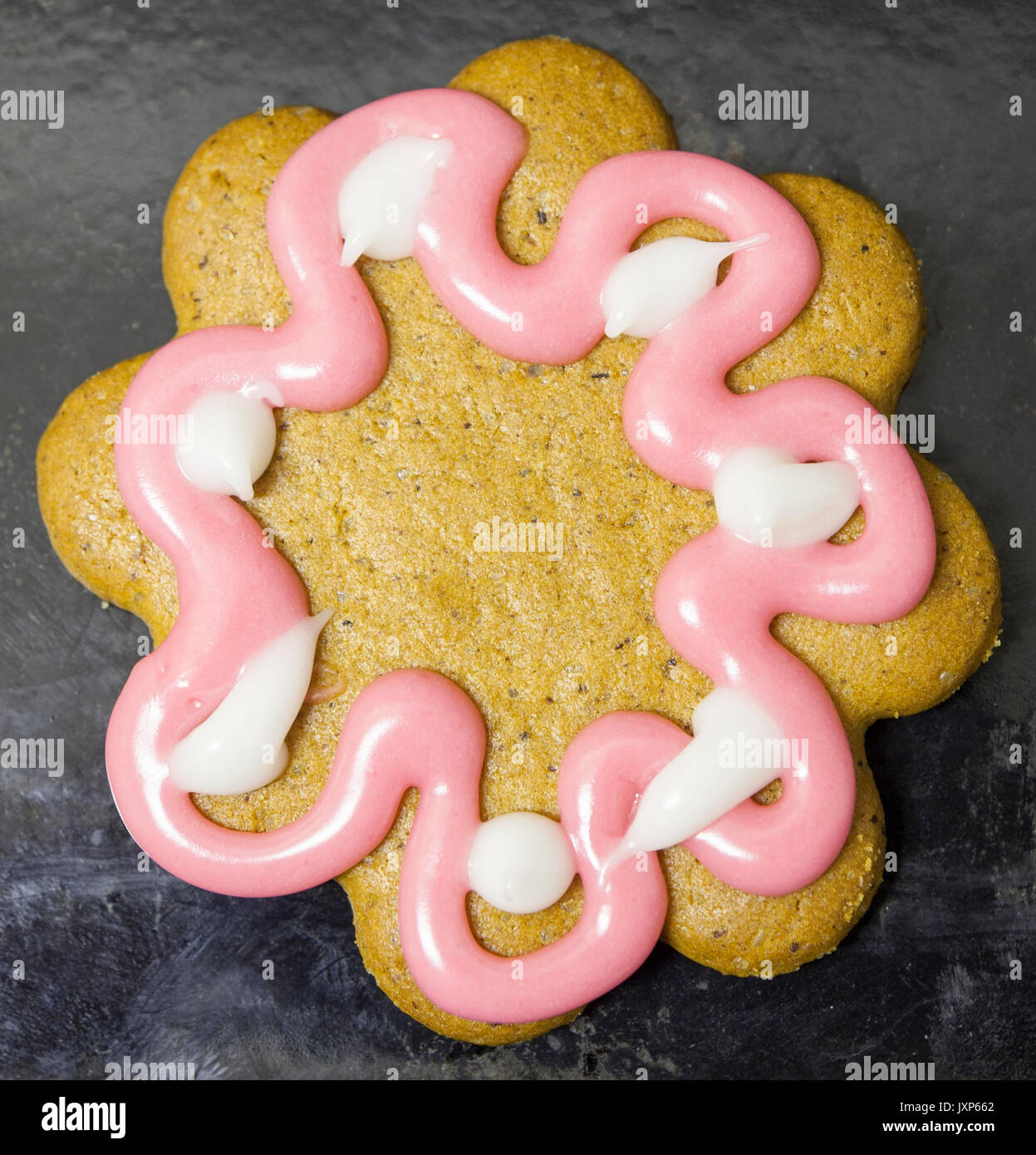 Freshly made homemade gingerbread ginger cookie decorated with coloured