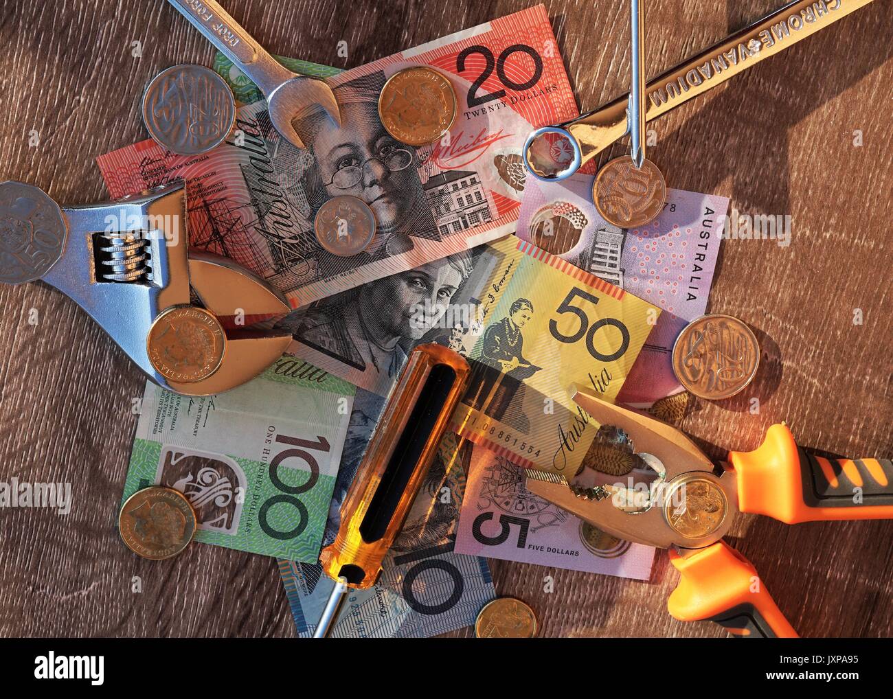 Australian dollars and workers tools outdoors Stock Photo