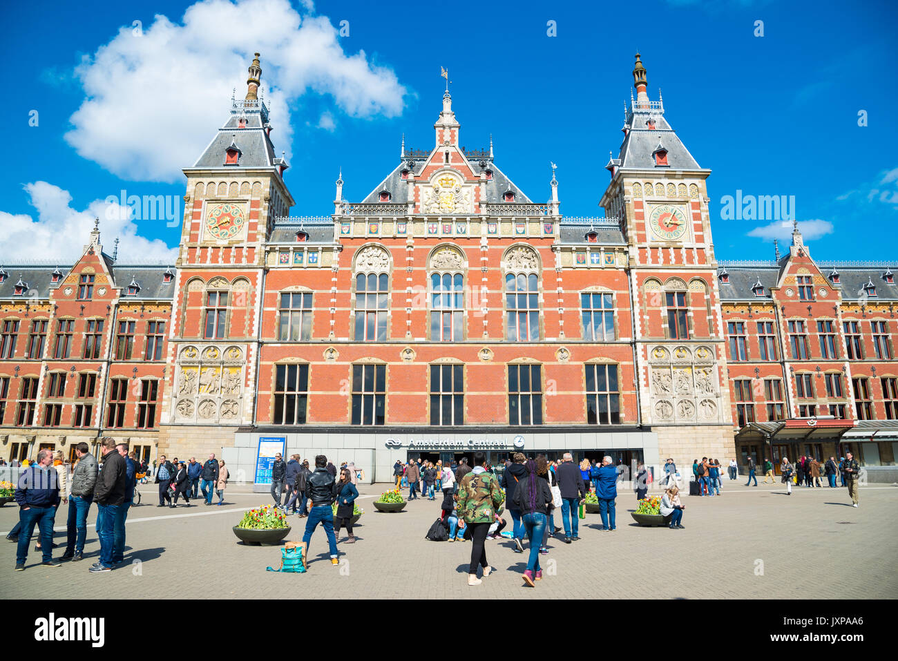 Amsterdam, Netherlands - April 19, 2017: Amsterdam Central Station in the sunny day, Netherlands Stock Photo