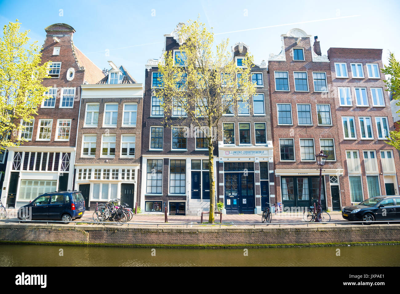 Amsterdam, Netherlands - April 20, 2017: Traditional old buildings in Amsterdam, the Netherlands. Stock Photo