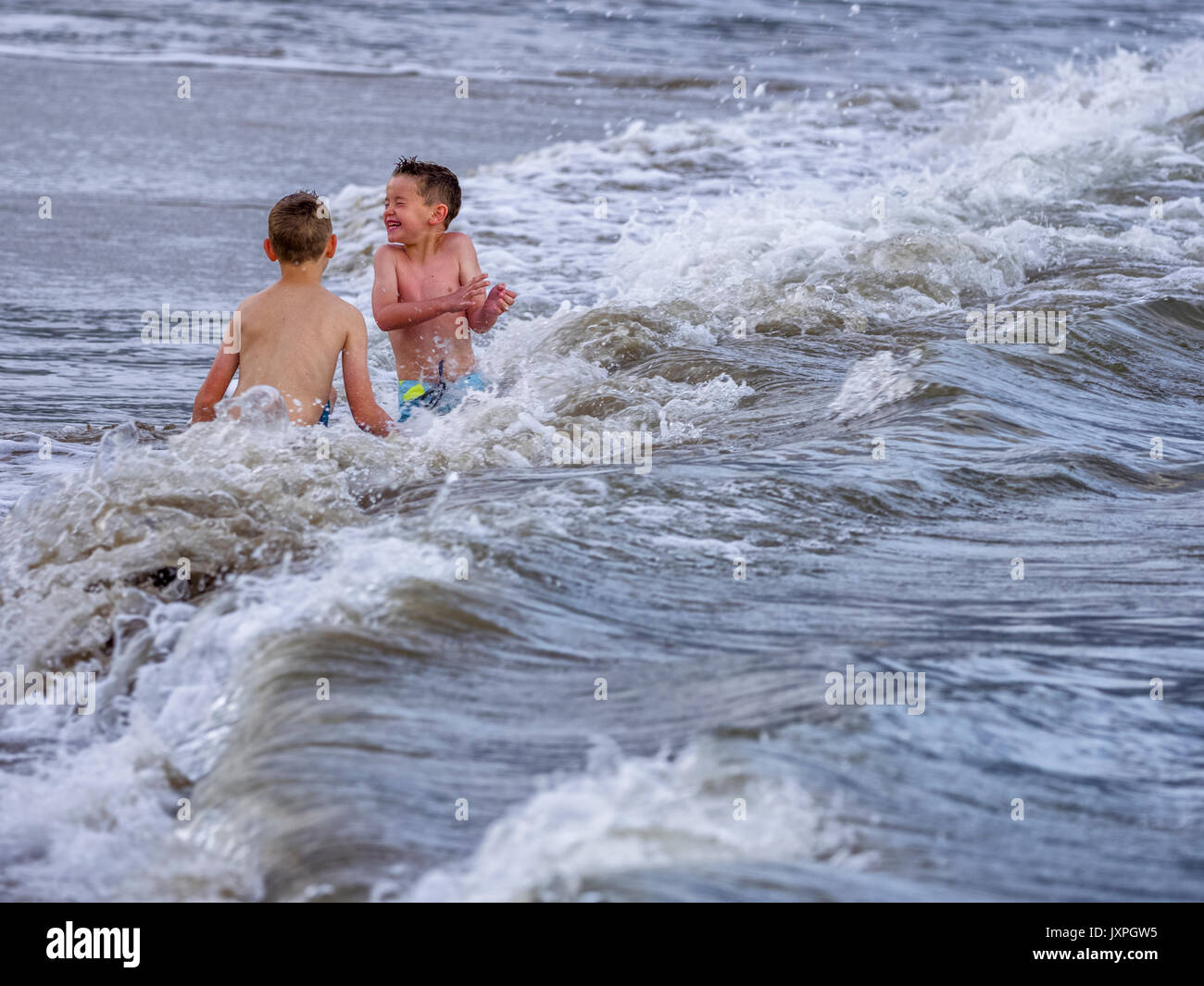 Young brothers enjoying the beach on Kauai Stock Photo Alamy