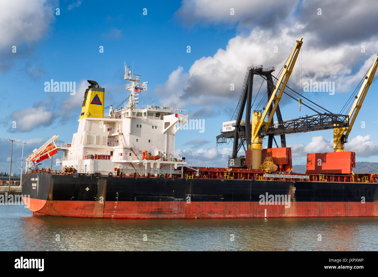 OAKLAND, CA-OCT 20, 2014: Cargo ship waiting for loading at the Port of Oakland, one of the busiest in the country, and an economic engine in the San  Stock Photo